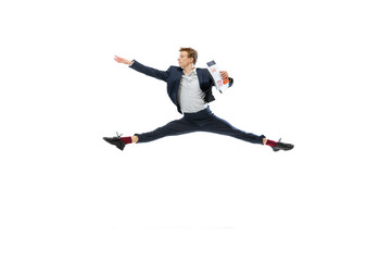 Fototapeta na wymiar Young man in dark business suit jumping, flying isolated on white background. Art, motion, action, flexibility, inspiration concept.