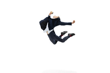Portrait of flexible man in business style clothes dancing isolated on white studio background....