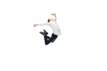 Studio shot of young male ballet dancer wearing business suit dancing isolated on white studio...
