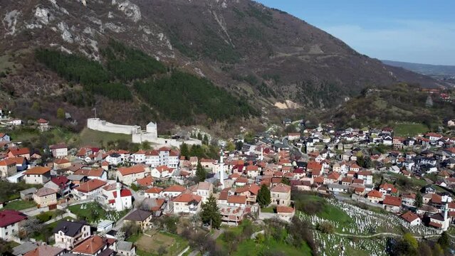Aerial drone view of Travnik. Old town, medieval walls, buildings, mosques and fortress on the hill. Travnik, Bosnia and Herzegovina. 