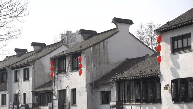 Lanterns hang on the wall in an ancient Chinese town