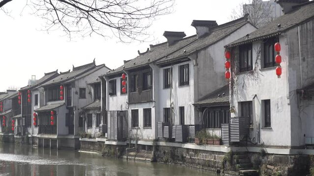 Lanterns hang on the wall in an ancient Chinese town