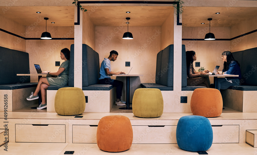 Poster A calm clean space is best to work in. Shot of creatives working in cubicles.