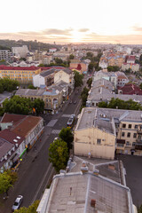 Fototapeta premium Ukraine, Kyiv – July 04, 2015: Aerial panoramic view on central and historical part, area of city Podil with residential buildings in the evening, during the sunset. Pre-revolutionary buildings