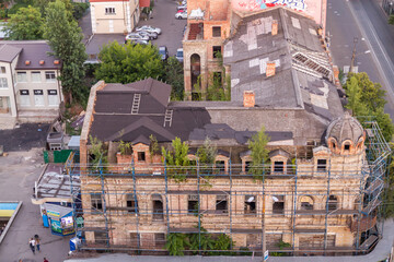 Obraz premium Ukraine, Kyiv – July 04, 2015: Aerial panoramic view on central and historical part, area of city Podil with residential buildings in the evening, during the sunset. Pre-revolutionary buildings