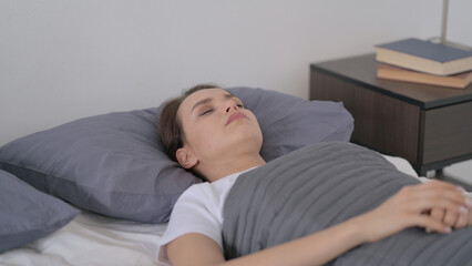 Fototapeta premium Woman Feeling Uncomfortable while Sleeping in Bed