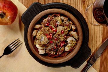 Traditional Georgian kuchmachi of chicken livers, hearts and gizzards with onion and pomegranate seeds