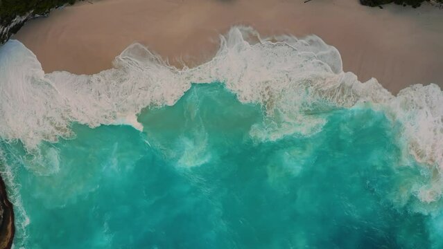 Aerial top view on coastline tropical beach with scenery waves crashed on tropical beach 4K