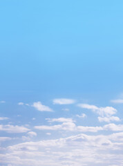 Blue sky with white fluffy cirrus clouds, soft focus. Heavenly clouds background summer. Concept of...