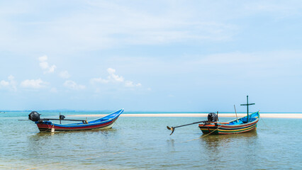 Traditional fishing boats on seaside vacation with blue sky summer season 