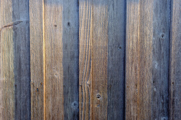 Fototapeta premium Graphic image of sunset light striking a restored old wooden building side in Roanoke North carolina