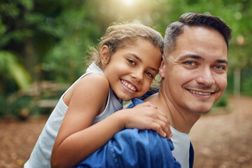 Naklejka premium Making his daughters childhood a blissful one. Cropped portrait of a happy father piggybacking his daughter at the park.