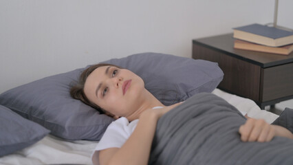 Woman Waking up from Nightmare in Bed