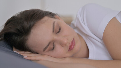 Obraz na płótnie Canvas Woman Sleeping in Bed Peacefully 