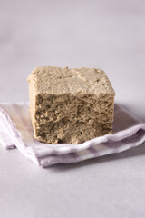 Sesame halva grey background Traditional middle eastern sweets Jewish turkish arabic national dessert Turkish delight.