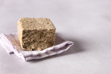 Sesame halva grey background Traditional middle eastern sweets Jewish turkish arabic national dessert Turkish delight.