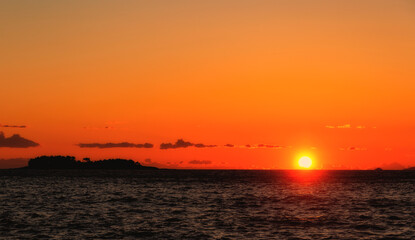 The sun sets over the horizon in the Adriatic Sea