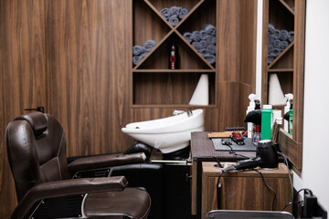 new clean stylish designer hairdresser with leather armchair and tool