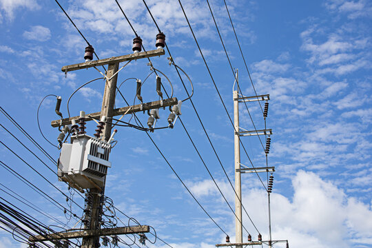 Electric poles and transformers on a clear day