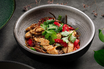 Bowl of asian soba noodles wok with chicken