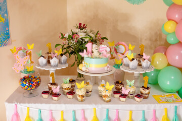sweet counter with cakes and candies