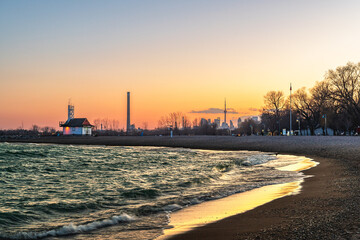 Leuty Lifeguard Stationat sunset with Toronto's downtown  skyline in the background.  Shot in...