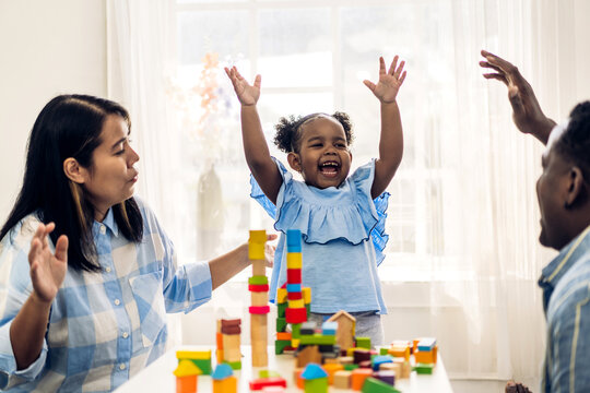 Portrait Of Happy Love Black Family African American Father And Mother With Little Girl Smiling Activity Learn And Skill Brain Training Play With Toy Build Wooden Blocks Board Education Game At Home