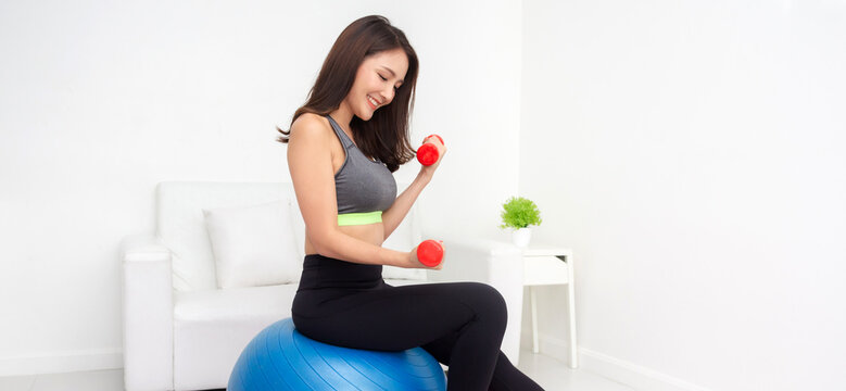 Portrait sport asian beauty body slim woman in sportswear sitting relax and girl practicing yoga and do fitness exercise in bedroom at home.Diet concept.Fitness and healthy