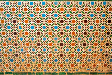 Colorful tiles in a medieval palace in Granada, Spain
