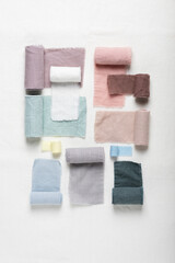 Different colors fabric samples on the white table
