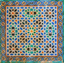 Colorful tiles in a medieval palace in Granada, Spain
