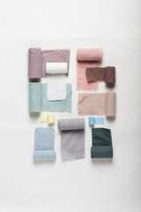 Different colors fabric samples on the white table