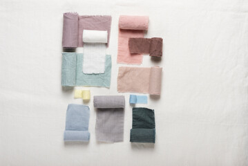 Different colors fabric samples on the white table