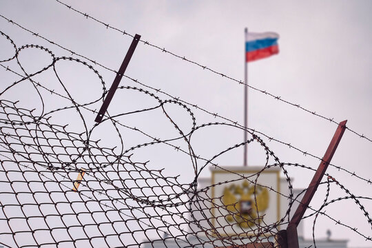 concept of European and US sanctions pressure on the Russian Federation government. flag of the Russian Federation in barbed wire, sanctions and aggression of Russia. Russian prison