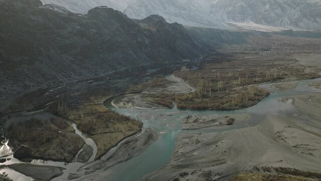 Phandar Valley at Ghizer Gilgit Baltistan in Pakistan. Autumn scene, blue turquoise water of Gilgit river flowing 
