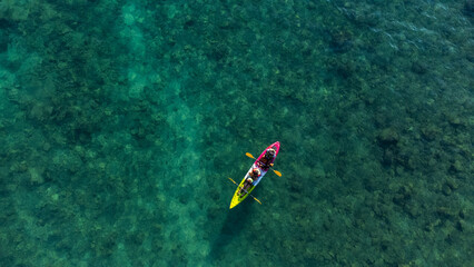 Top view of canoe. people boating in the sea.