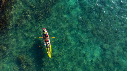 Top view of canoe. people boating in the sea.