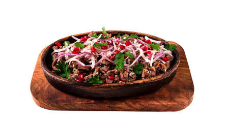 Kuchmachi, a traditional Georgian dish, in a clay Ketsi plate, close-up,