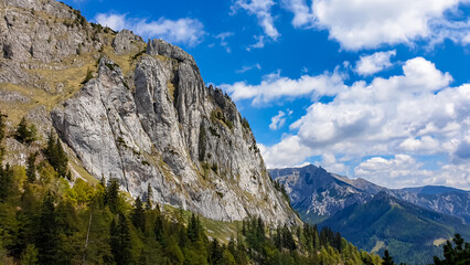 Fototapeta na wymiar Panoramic view on the mountain peaks of the Hochschwab Region in Upper Styria, Austria. Sharp summit of Zinken in the beautiful Alps in Europe. Climbing tourism, wilderness. Concept freedom