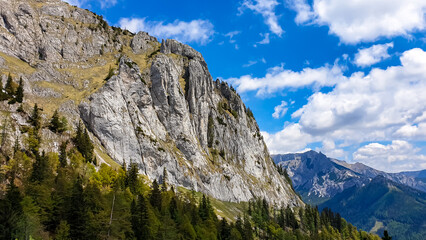 Obraz premium Panoramic view on the mountain peaks of the Hochschwab Region in Upper Styria, Austria. Sharp summit of Zinken in the beautiful Alps in Europe. Climbing tourism, wilderness. Concept freedom