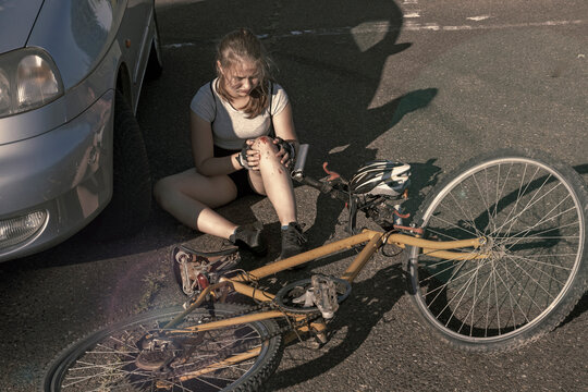 Cyclist Is Suffering After Her Bicycle Hit Car