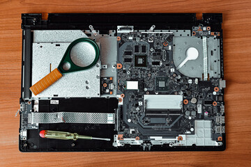 Fototapeta premium repair of printed multilayer circuit board (PCB) close-up, microcircuit elements, repair and diagnostics in service, laptop repair