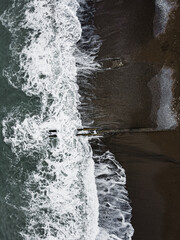 Aerial drone photo of sea beach with wave splash cloudy weather after before the storm island beach