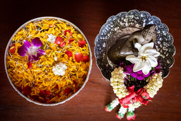Water bowl filled with flowers for Songkran festival in Thailand