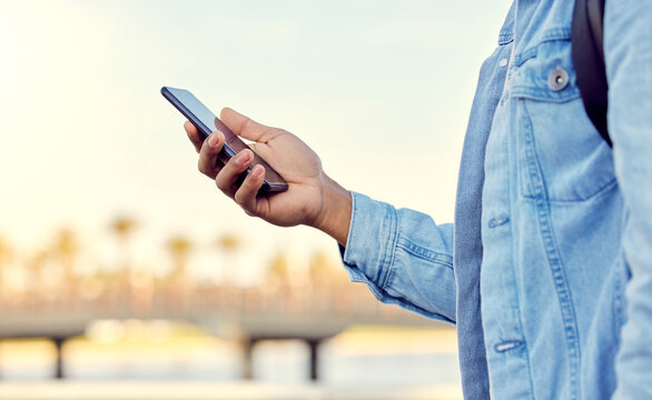 I Find My Way Around With A Little Help. Cropped Shot Of A Man Using His Cellphone While Standing Outside.