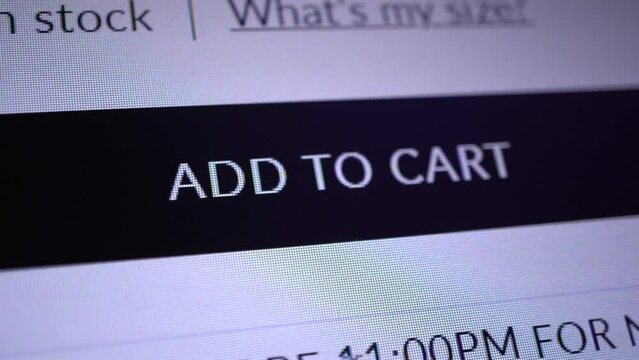 Mouse cursor clicks on the "Add To Cart" button. Macro shot close up of design UI, mock-up. Screen of a monitor or gadget showing a button for an online application or website for shopping.