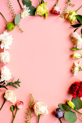 flowers, buds of flowers, roses and chrysanthemums, carnations on a pink background, buds and leaves lie beautifully with a place for text and congratulations