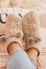 Handmade knitted socks on the legs