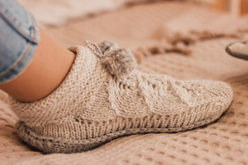 Fototapeta na wymiar Handmade knitted socks on the legs