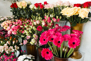 Beautiful different flowers bouquets at street floristic shop